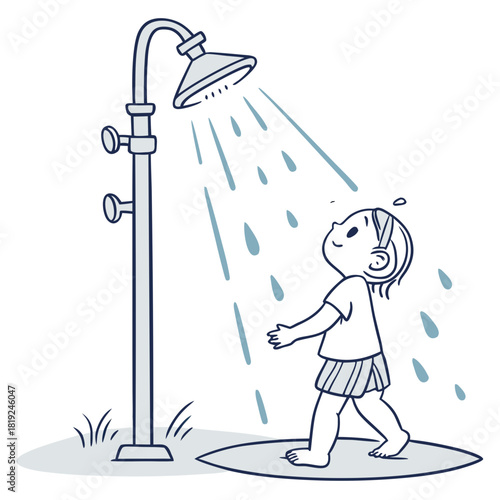 Joyful child walks under an outdoor shower enjoying the refreshing water on a warm day