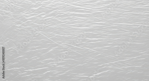 Crumpled white plastic texture background with subtle light reflections and detailed surface folds for modern packaging design