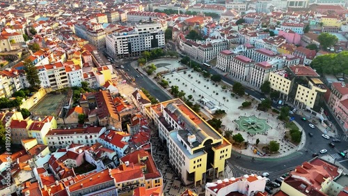 Lisbon at Sunset from Above – Drone View of Historic Rooftops, Red Palm Trees, Ocean Atmosphere and Timeless City Square