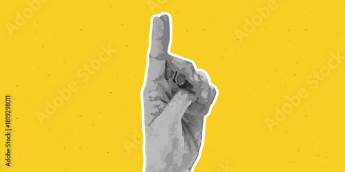 Hand with index finger pointing up on yellow textured background