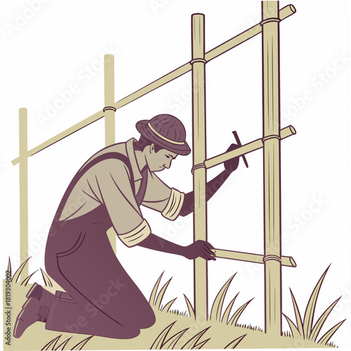 Farmer wearing overalls and hat building a bamboo trellis structure in a garden with grass