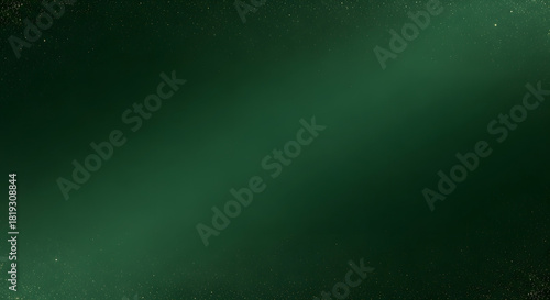 Elegant Deep Emerald Green Background with Subtle Golden Glittering Dust for Holiday Designs