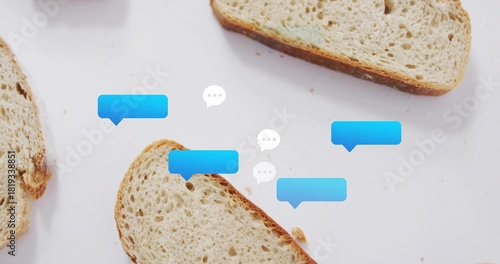 Displaying whole-grain bread slices and crumbs on white tabletop with blue and white speech bubbles