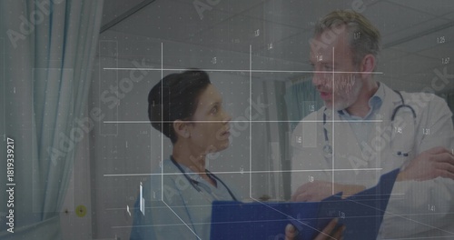 Reviewing blue folder, nurse in scrubs pointing, doctor in labcoat listening in ward, digital grid
