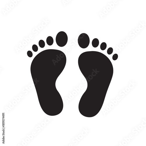 Black silhouette of two human footprints, representing walking, health, or baby steps, isolated on