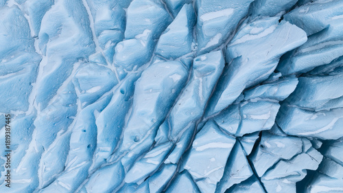 Aerial view of the icy, fractured landscape revealing a symphony of glacial blues and stark white contrasts, Jokulsarlon, Sveitarfelagid Hornafjordur, Iceland.