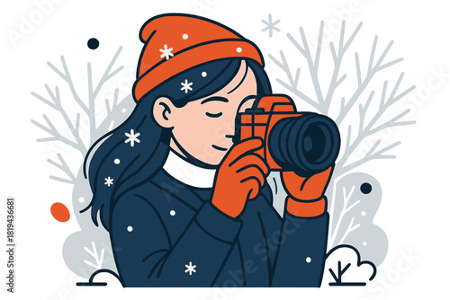 Winter Photography Moment. Winter snapshot. Girl holding camera close to face, snowflakes landing on hair,