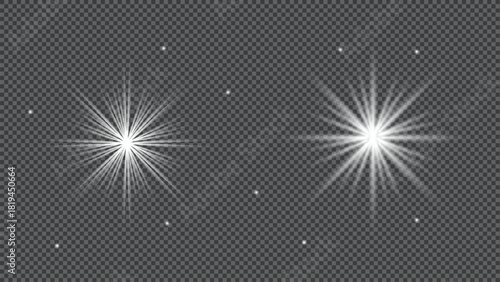 Two bright white starburst light effects with lens flare isolated on transparent background