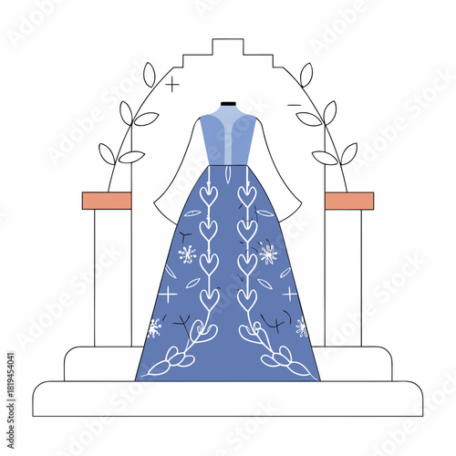 Elegant blue dress displayed on a pedestal with floral accents