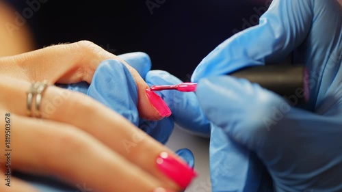 Slow application of bright gel polish for maximum coloring of the nail plate. High quality 4k footage