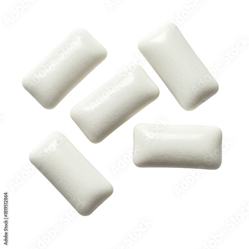 White rectangular chewing gum pieces with rounded edges and sugar-coated surface, individually isolated on a transparent studio background with high-key lighting. Concept for confectionery product