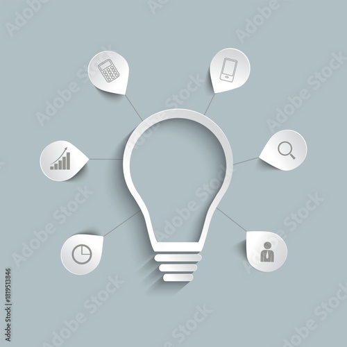 A light bulb for a business idea, brainstorming session. A paper light bulb on a gray background.