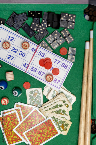 Collection of classic board games, scattered haphazardly on table, perfect for game nights and leisure time. Top view