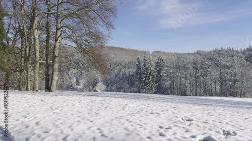 Clearing the snow on a bright Winter day in the Countryside using heavy Machinery