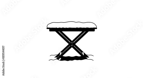 Folding table covered with snow on transparent background