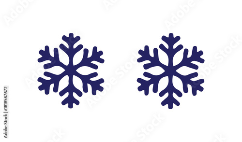 Two dark blue snowflake shapes on a white background