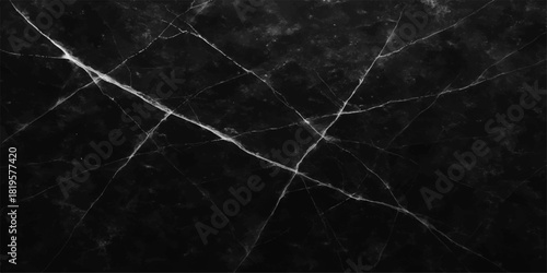 Dark, macro, black and white backdrop of water drops on a rough, textured, grunge surface