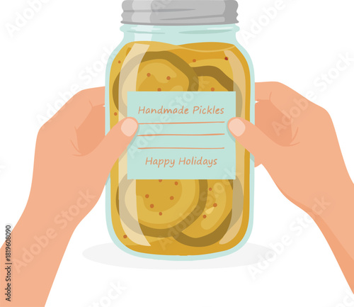 A pair of hands gently holds a jar of handmade pickles with a holiday label, creating a warm and homey festive feeling