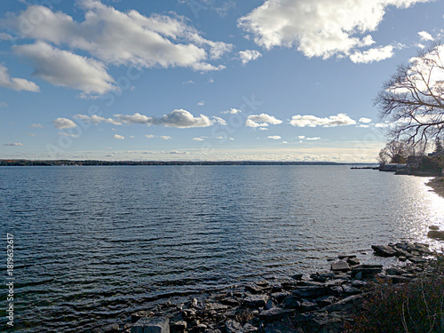 White clouds over a river on a fall day