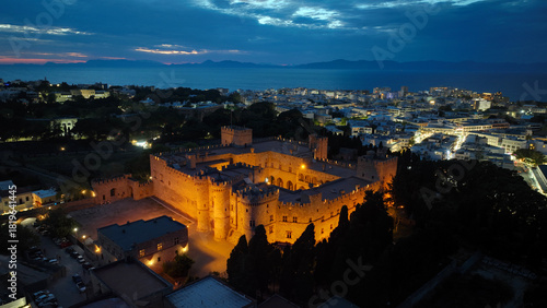 Aerial drone night shot of iconic Palace of the Grand Master in old town of Rhodes island, Dodecanese, Greece