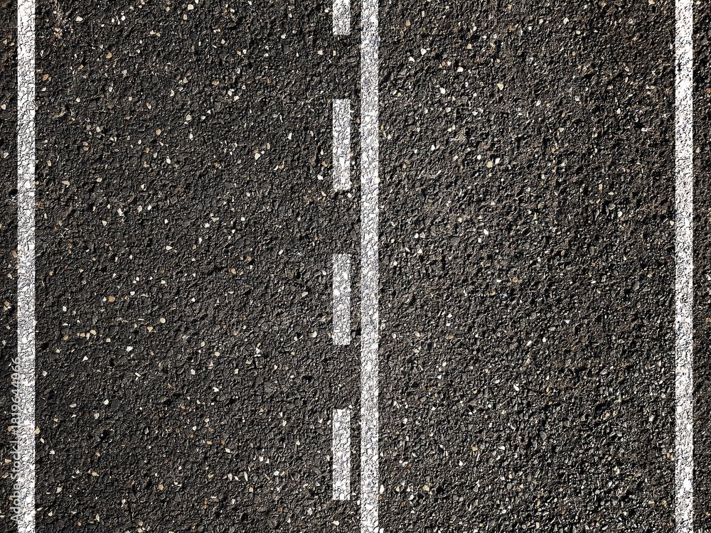 Fototapeta premium Dotted and solid double white lines on asphalt road.