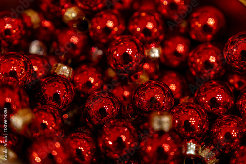 Red Christmas background made of small glass balls.