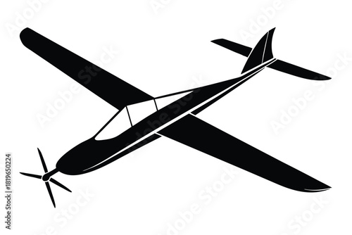 A sleek black airplane soars with wings angled against a stark white background