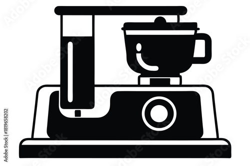 Simple black and white electric food processor with round start button sits ready