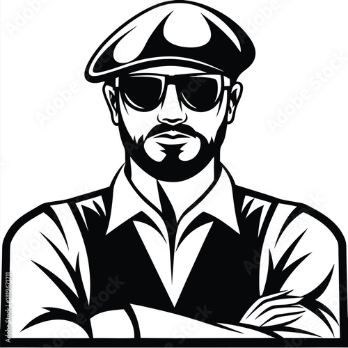 Man with a beard wearing a cap and sunglasses poses with arms crossed
