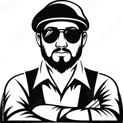 Man wearing sunglasses, flat cap, beard and shirt stands with folded arms in black and white