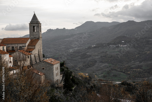 Wallpaper Mural Italian church bell tower dominating ancient village homes on a hillside, overlooking a vast rural valley landscape, Agnone, Molise, Italy Torontodigital.ca