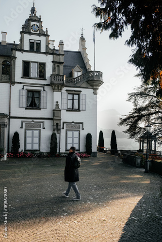 European castle in Switzerland with trimmed bushes and fall landscape