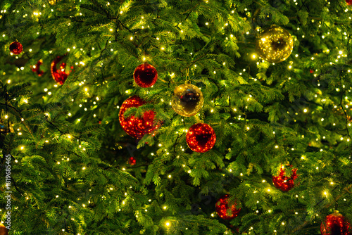A Christmas tree with shining lights. New Year's background. Illumination at the Basel fair. Festive winter background. The creation of a miracle. Christmas market in Basel.