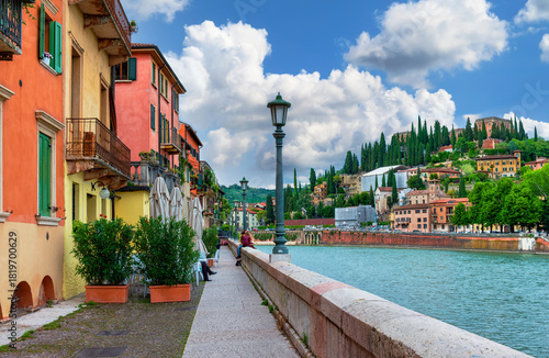 View of Adige river embankment in Verona, Italy. Architecture and landmarks o...