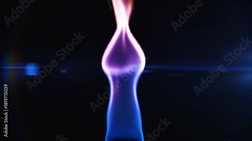 Abstract flame in motion on dark background with blue and purple highlights
