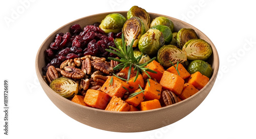 Healthy bowl of roasted vegetables and nuts on white background  
