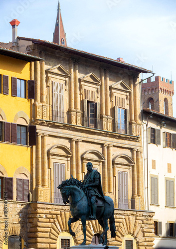 Equestrian Statue in Front of Historic Italian Town Hall Building with Ornate Facade and Tower