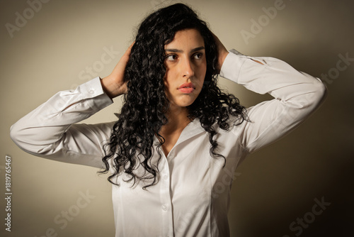 Woman covering ears escaping loud noise or stress