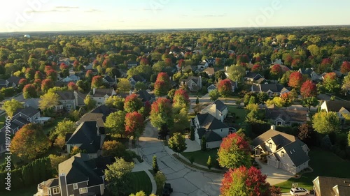 Establishing shot of Midwestern United States. American neighborhood in Fall season. Aerial view of houses. Small town