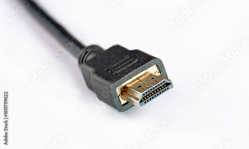 A close up of a HDMI cable on white background. Selective focus