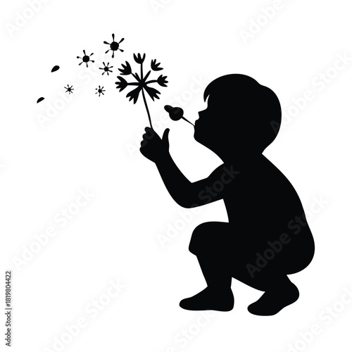 Child blowing a simple dandelion