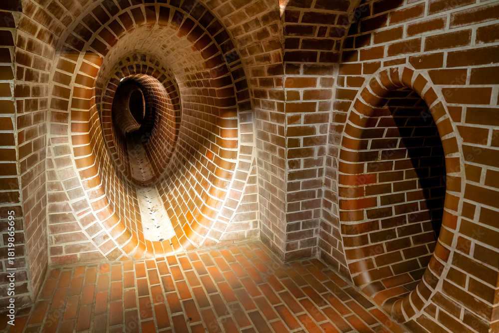 Fototapeta premium Exploration of Warsaw’s sewer system highlighting underground passageways and pipes
