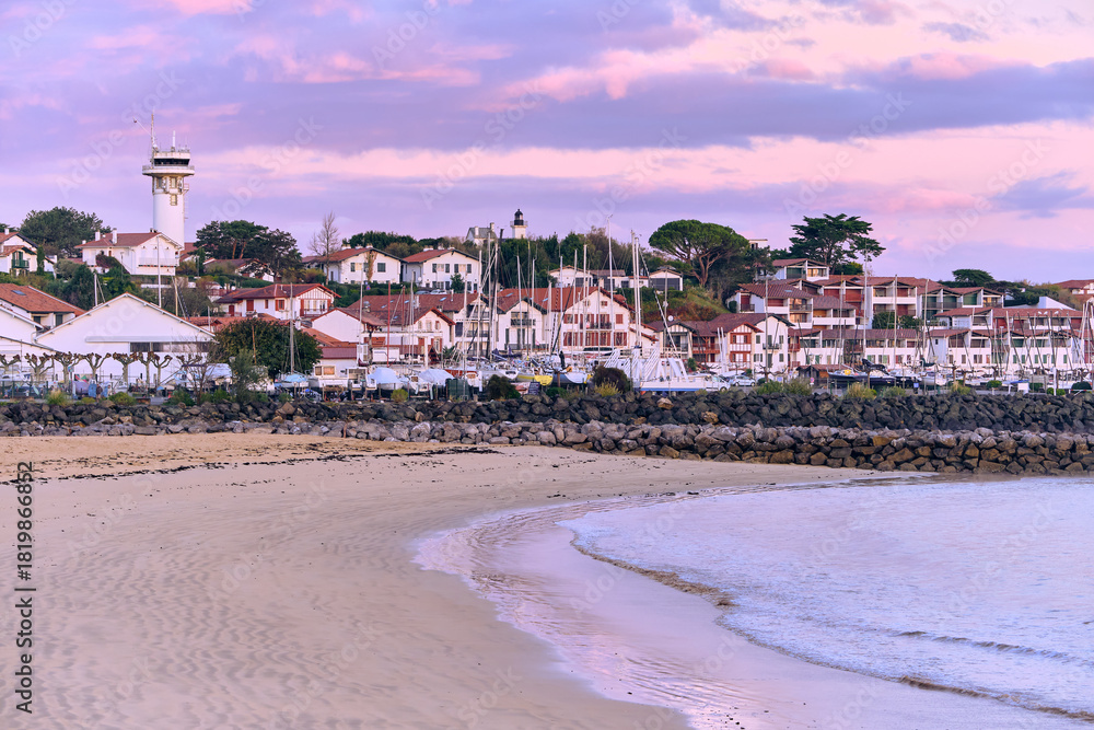 Fotobehang Purper Saint-Jean-de-Luz Basque Country France Coastal Scenery with houses, beach and pier at dawn #1819866852