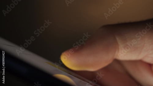 Man Using Mobile Phone in Dark. Finger Scrolling on Screen. Close-up Finger Scrolling Social Media App Feed or Reading News Feed Online. Person Using Smartphone, Browsing at Night. Addiction Insomnia.