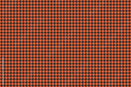 Vibrant orange and black houndstooth pattern.  Perfect for textile design, fashion,  website backgrounds, or any project needing a bold, geometric texture.