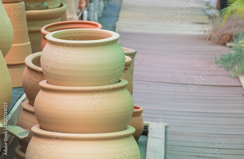 Stack of unglazed terracotta clay pots for sale