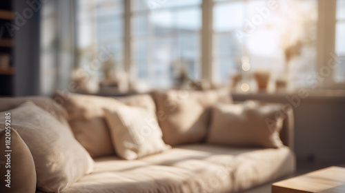 Blurred modern living room interior background with beige sofa