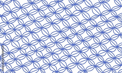 Illustration of a repeating geometric pattern in blue. The repeating oval pattern resembles a batik design.