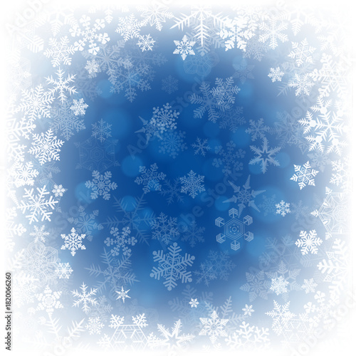 白い雪の結晶が散りばめられた冬の幻想的な青いベクター背景