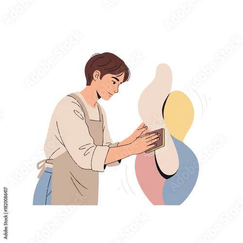 Artist meticulously sands abstract sculpture, showcasing dedication to craft and creative process